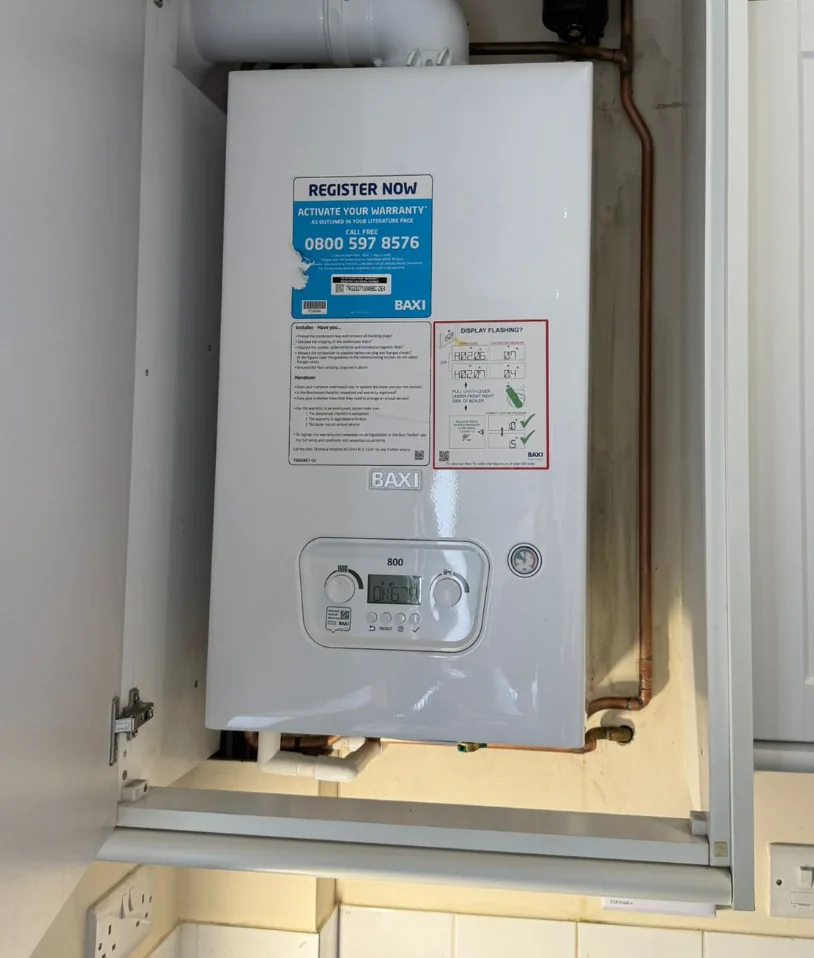 Baxi 800 combi boiler neatly installed in a kitchen cupboard by KAS Energy Baxi Approved installers in Derbyshire