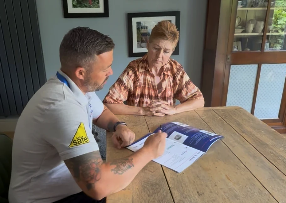 KAS Energy sales advisor showing a Derbyshire homeowner the best Baxi boiler options - one of the best boiler brands in the UK